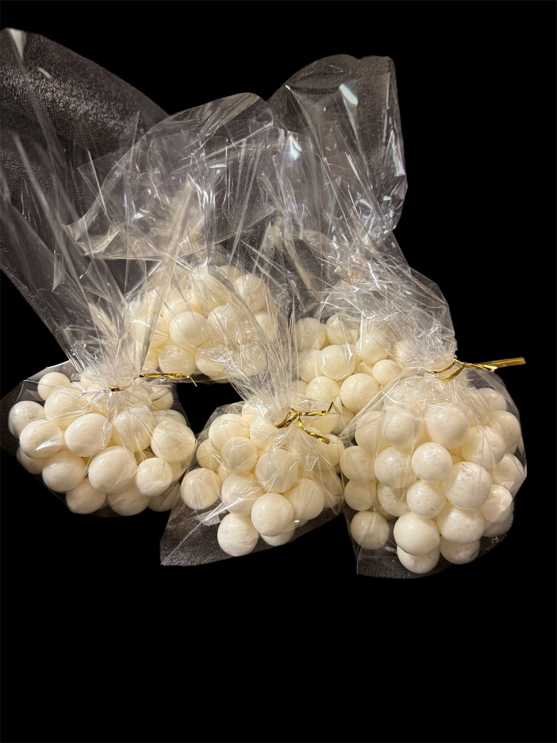 Several clear bags filled with white puffs of freeze-dried salt water taffy.