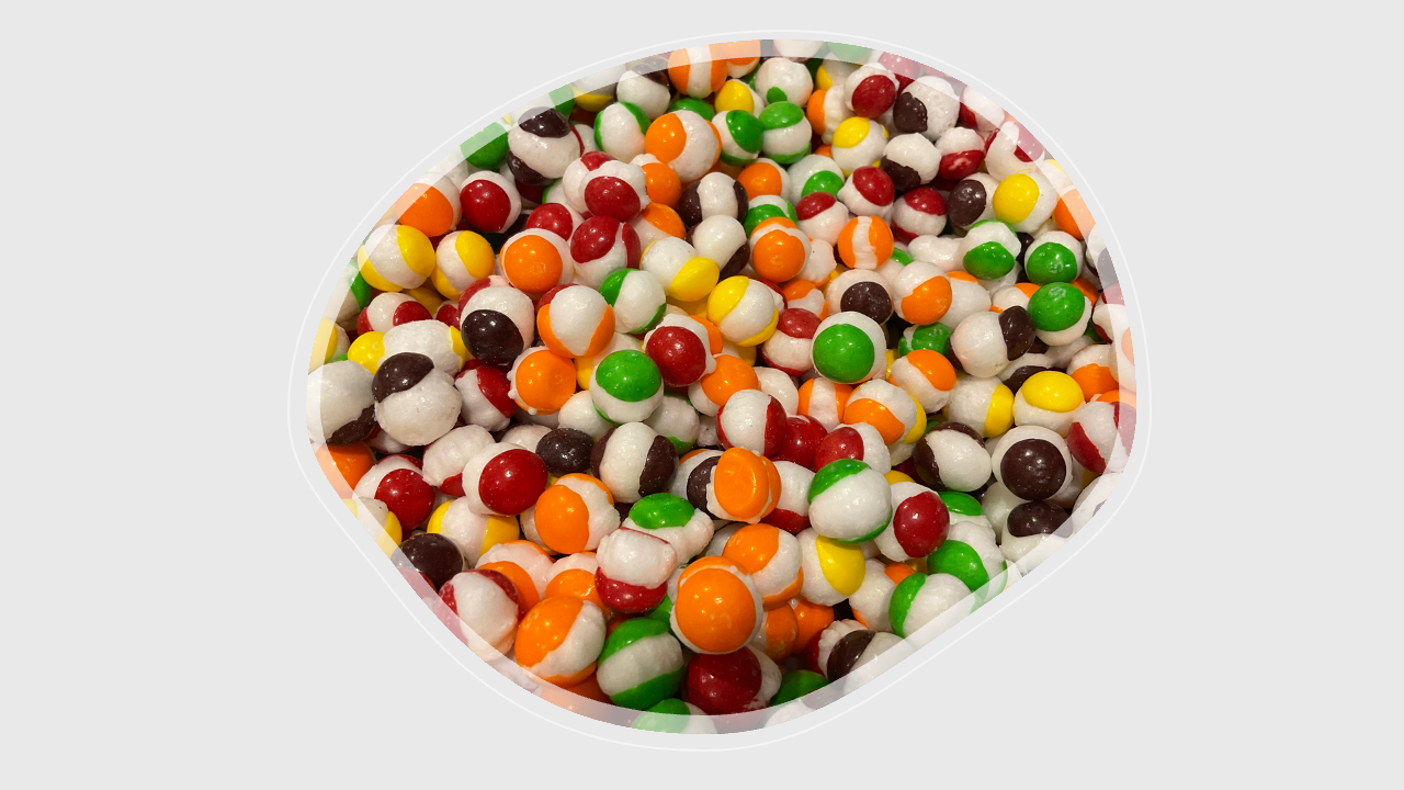 Close-up of airy, crispy freeze-dried Skittles showing vibrant colors and texture