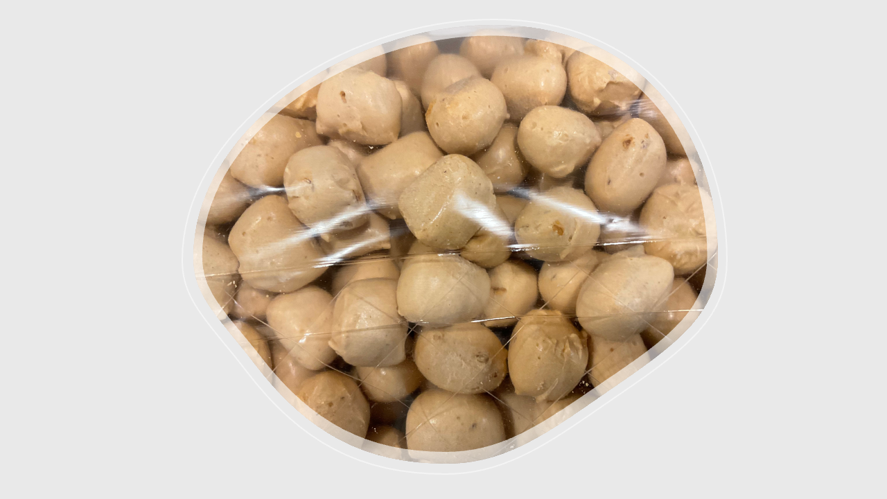 Close-up of crispy, airy freeze-dried Bit-O-Honey showing texture and almond pieces